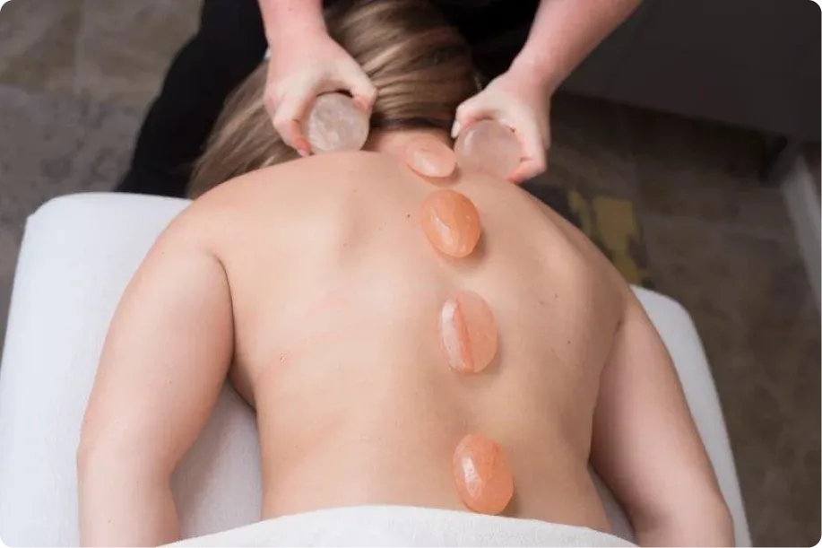 Person getting Himalayan Salt Stone services